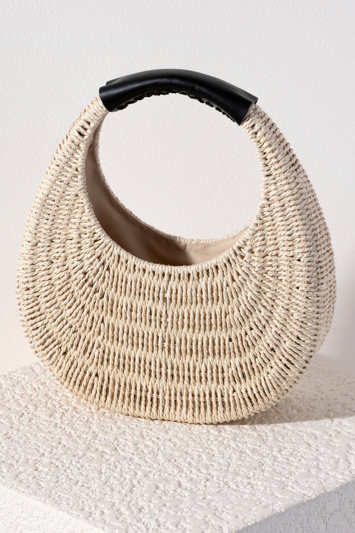 The bag of the summer is here! Whether you're headed to a picnic or the beach, Shiraleah's Menorca Bag is the perfect accessory for any outfit. Made from strong woven paper straw with a single top handle, this chic circular purse is both lightweight and trendy. Pair with other items from Shiraleah to complete your look!