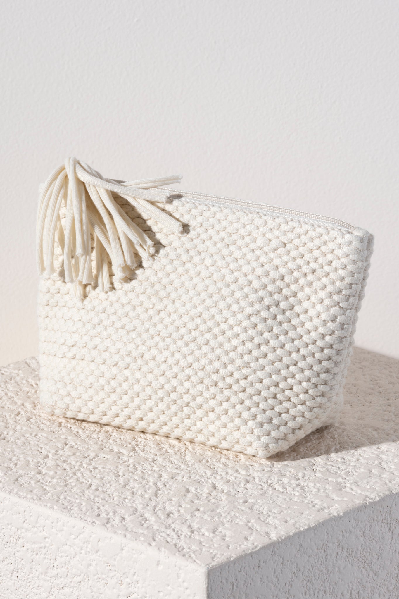 Show off your playful side with Shiraleah's Mavis Zip Pouch. Made from soft woven fabric with a fun tassle detail, this small cosmetic pouch is the perfect size to store all your odds and ends. Pair with the matching Mavis Tote and other items from Shiraleah to complete your look!
